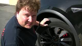 Taking tire and rotor measurements on a Tesla model X with iGAGING tools.