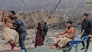 Chavil family crossing the river to take the injured patient to the hospital