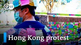 Hong Kong pro-democracy and pro-Beijing protesters clash at foreign universities | DW News