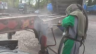 SandBlasting rust off a bulk trailer