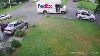 Fedex leaving package almost at street.