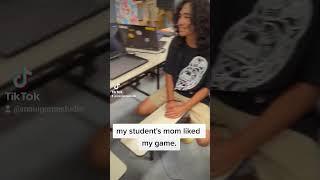 Letting my student's mom play the game I made.