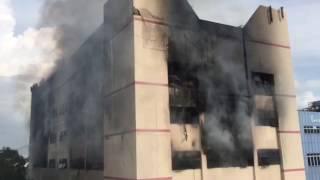 C K Building smouldering more than two hours after fire was reported