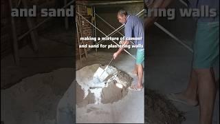 making a mixture of cement and sand for plastering walls