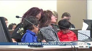 Senior woman begins new life with adopted sons