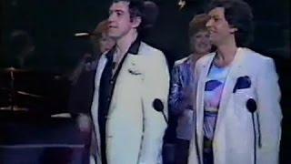 Martin Shaw and Lewis Collins bowing to the audience and the Queen on a Royal Variety Performance