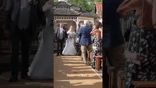 bride and groom walk up the aisle