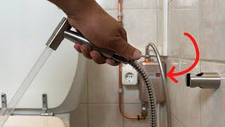 A plumber shows how to connect a toilet shower to amazing mini electric water heater