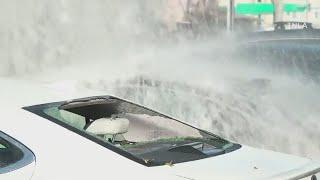 Water main break shatters car windows in West Hills