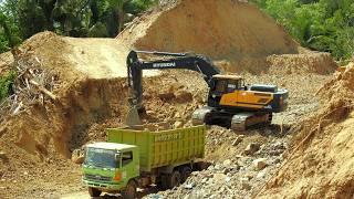 Excavator Dump Trucks Diggin Road Construction On The Hill