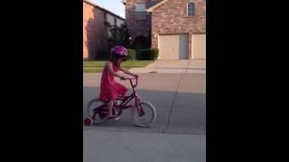 Emma riding her bike