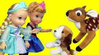 Elsa and Anna toddlers feed cute stuffed animal pets