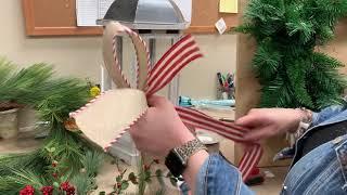 Decorate a wreath or lantern for Christmas using floral stems and ribbon with Anna from Dee’s