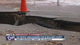 Boulder flooding opens large hole in roadway