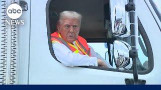 Trump speaks to reporters from garbage truck on campaign trail