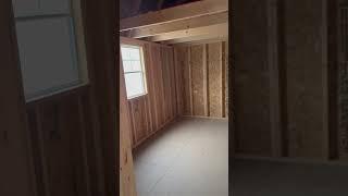 Blue tiny home loft at each end lots of space open concept