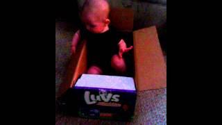 Baby Corbin loves his luvs diaper box @ 5 months old