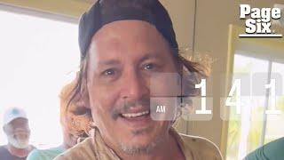 Johnny Depp flashes seemingly new pearly whites after his ‘rotting’ teeth went viral