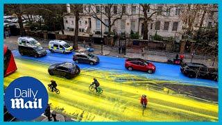 Four arrested after painting giant Ukraine flag outside Russian embassy in London