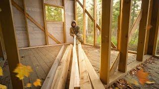 I finished sheathing the house with boards. Building a house in the woods.