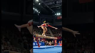 #ArtisticGymnastics #GymnastInAction #FemaleAthlete #OlympicLevel #AthleticElegance #HighPerformance