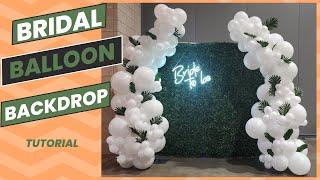 Greenery backdrop with balloons