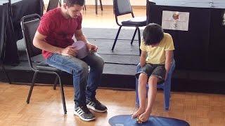 8 yrs old boy solving rubik's cube with feet 38.2 sec