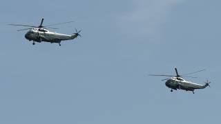 Helicopters fly ahead of President Trump's trip to Europe for NATO summit