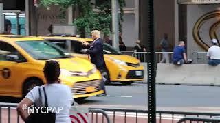 A Donald Trump directs traffic outside Trump Tower in New York City