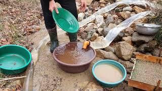 The process of extracting gold from rivers and streams