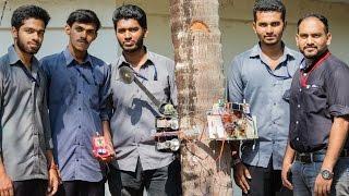 Remote controlled coconut climber and harvester climbing up  ! our final year project working video