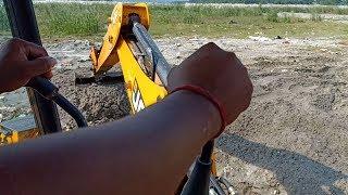 Skillful Operator-INSIDE the CABIN-Operating JCB Backhoe