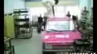 Idiot does a backflip in his garage