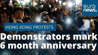 Pro-democracy demonstrators in Hong Kong mark six months of protests