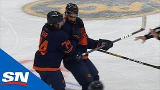 Jujhar Khaira Has Trouble Skating Off After Huge Check From Alexander Romanov