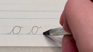 Lowercase "o" in cursive