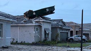 Tornado deposits dumpster onto roof of Palm Beach Gardens home