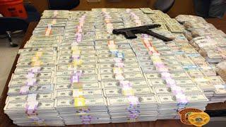 Buckets of money found in wall of home during drug bust in Miami Lakes