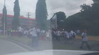 Schools around Port Moresby marching on the road with signs promoting safety