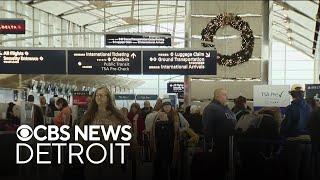 Travelers take flight at Detroit Metro Airport on final day of holiday travel season