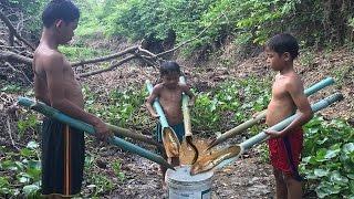 Three Boys Catching Eel Using Water Pipe Eel Trap