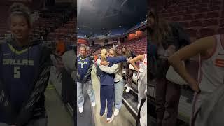 Paige Bueckers gives warm hugs to her former teammates as UConn women’s basketball team yesterday