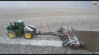 Working up a Snow Covered Field with a John Deere 9420R Tractor and high speed disk.