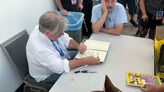 Matt Groening signing and sketching for fans at SDCC 2024