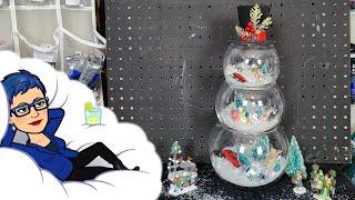 Let's build a Snowman village scene in some glass bowls. Video #422