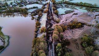 Canal burst after torrential rain devastating landscape | SWNS