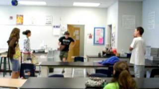 andrew oakley jumping over a desk