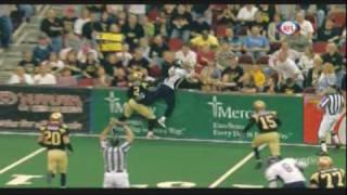 Football Player Dives Into Stands for Ball