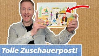 Weihnachtliche Zuschauerpost auspacken