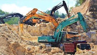 Excavators Digging Limestone And Loaded Into Dump Trucks For The New Road Construction